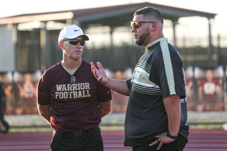 Tuloso-Midway Head Football Coach Kris O'Neal and Kingsville Head Football Coach Ruben Garcia decide to postpone Friday's game after a Kingsville coach suffered a medical emergency before the game, Sept. 22, 2023, in Corpus Christi, Texas.
