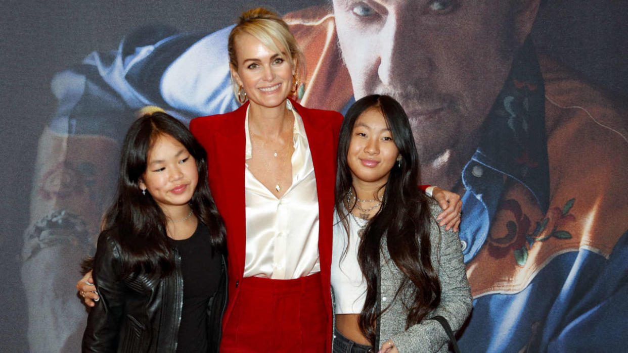 Laeticia Hallyday (C), widow of late French singer Johnny Hallyday poses with their daughters Jade an Joy upon their arrival at the premiere of 