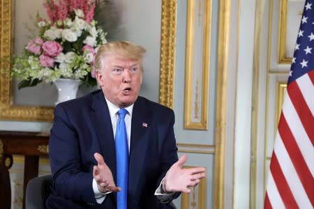 U.S. President Donald Trump and French President Emmanuel Macron meet at the Prefecture of Caen, Normandy