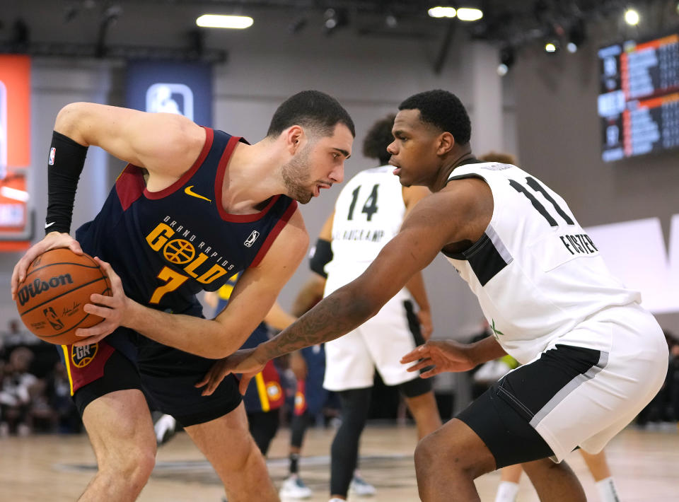 G League Ignite forward Michael Foster Jr. defends during a gamer in December. Foster is one of the draft combine risers. (Stephen R. Sylvanie/USA TODAY Sports)