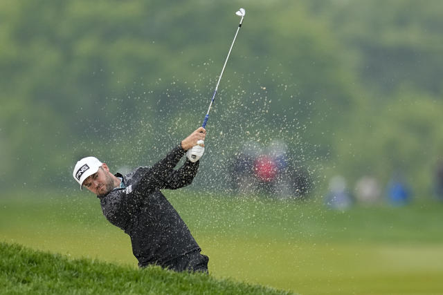 Corey Conners, of Canada, hits from the rough on the 17th hole during the third round of the PGA Championship golf tournament at Oak Hill Country Club on Saturday, May 20, 2023, in Pittsford, N.Y. (AP Photo/Abbie Parr)