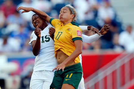 Jun 12, 2015; Winnipeg, Manitoba, CAN; Australia forward Kyah Simon (17) and Nigeria defender Ugo Njoku (15) go up for a header during the second half in a Group D soccer match in the 2015 FIFA women's World Cup at Winnipeg Stadium. Michael Chow-USA TODAY Sports