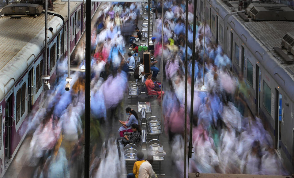 A general view of churchgate station during peak hours in Mumbai, India, Thursday, March 20, 2023. India, with over 1.4 billion people, is set to eclipse China to become the largest - and youngest - population in the world in April. Its demographic rise has coincided with a swelling economy that is the fastest-growing in the world. Only 39 million women are employed in India's workforce compared to 361 million men, according to the Center for Monitoring the Indian Economy (CMIE). (AP Photo/Rajanish Kakade)