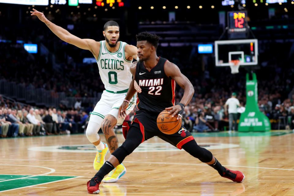 Celtics star Jayson Tatum and Heat counterpart Jimmy Butler each missed one of their teams' three meetings this season. (Maddie Meyer/Getty Images)