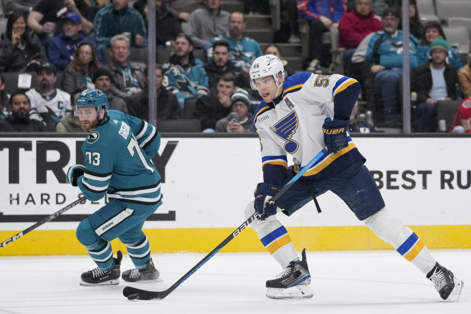 St. Louis Blues defenseman Colton Parayko, right, moves the puck during the second period of the team's NHL hockey game against the San Jose Sharks in San Jose, Calif., Thursday, March 2, 2023. (AP Photo/Godofredo A. Vásquez)