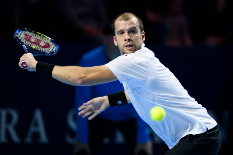 Luxembourg's Gilles Muller returns the ball to Bulgaria's Grigor Dimitrov during their tennis match at the Swiss Indoors tournament on October 25, 2016 in Basel