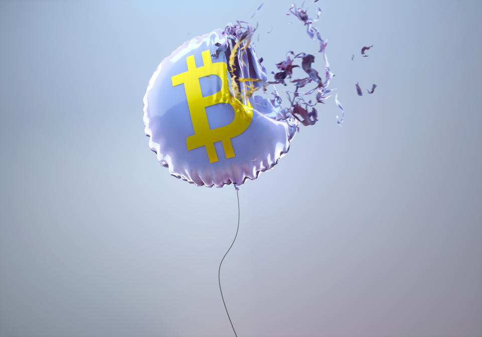 Digital generated image of purple circular helium balloon with bitcoin sign on it exploding against grey background visualising stock market crash.