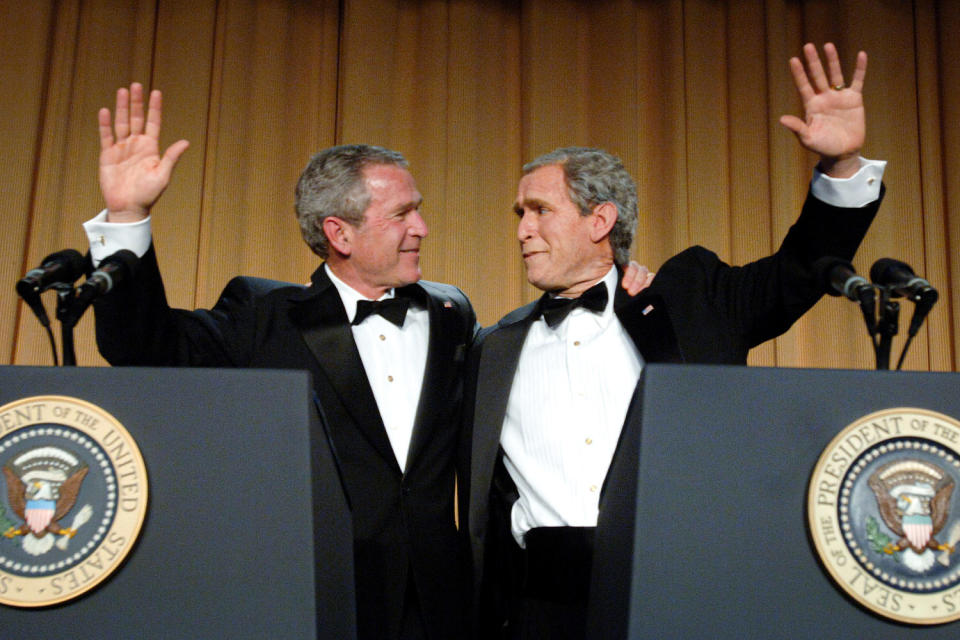 George W. Bush and his inner monologue, played by Steve Bridges. (Roger L. Wollenberg - Pool / Getty Images file)
