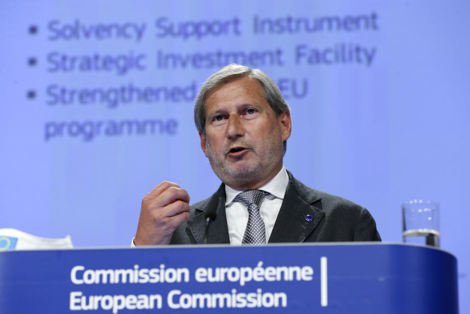 European Commissioner for Budget and Administration Johannes Hahn speaks during a media conference at EU headquarters in Brussels, Wednesday, May 27, 2020. The European Union unveiled on Wednesday a massive coronavirus recovery plan worth hundreds of billions of euros to help countries rebuild their ailing economies, but the bloc remains deeply divided over what conditions should be attached to the funds. (Francois Walshaerts, Pool Photo via AP)