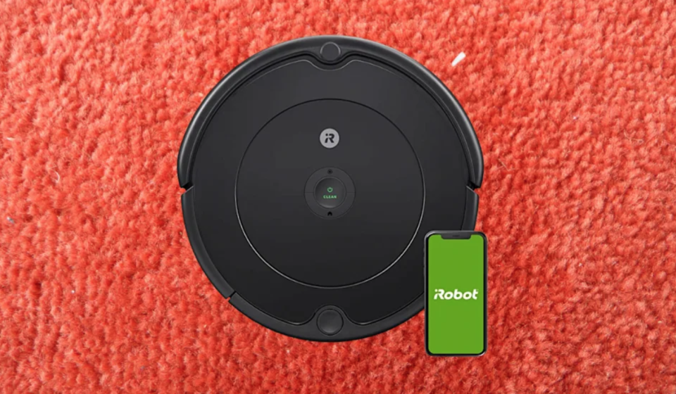 black robot vacuum with smartphone