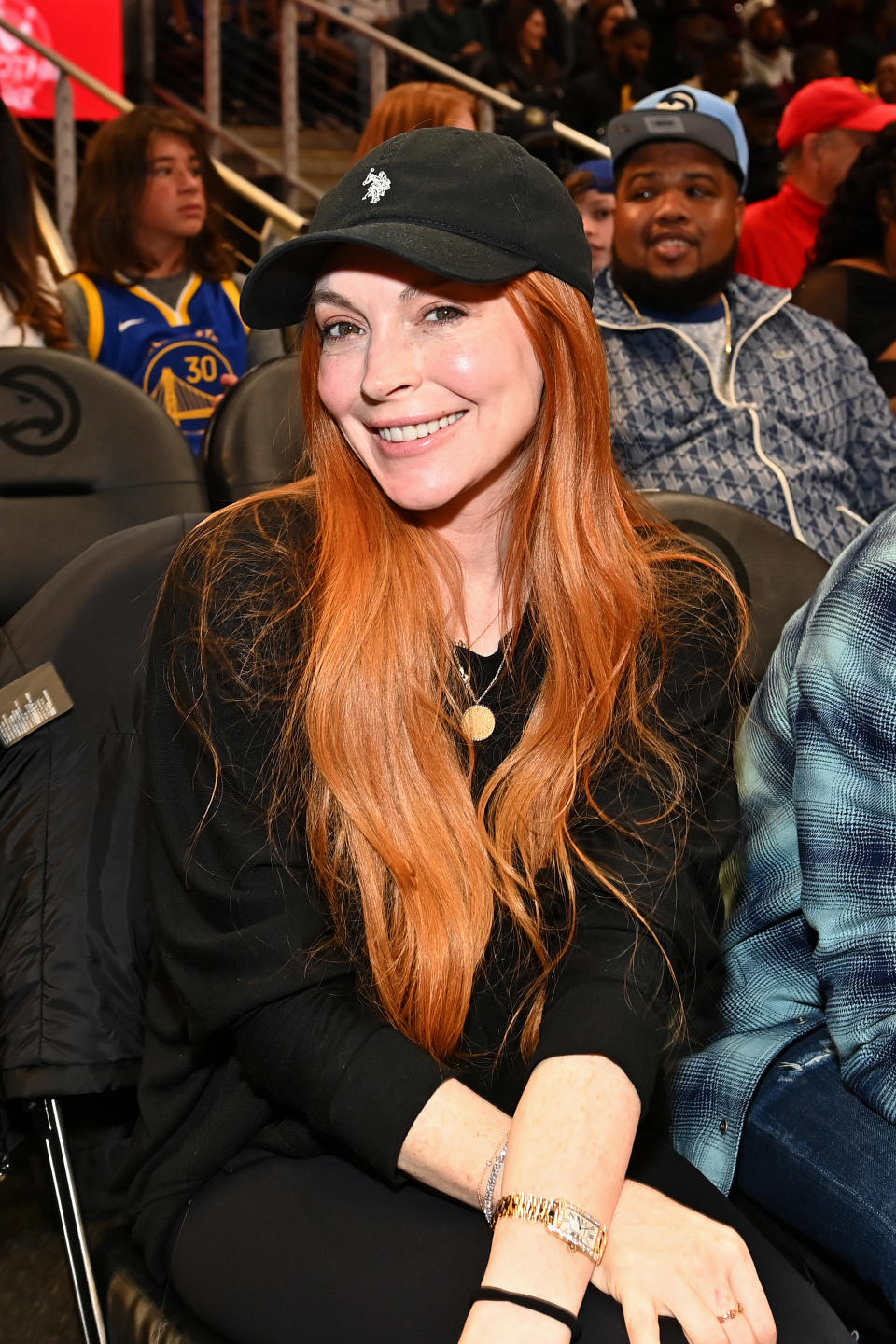 Actress Lindsay Lohan attends the game between Golden State Warriors and the Atlanta Hawks at State Farm Arena on February 03, 2024.