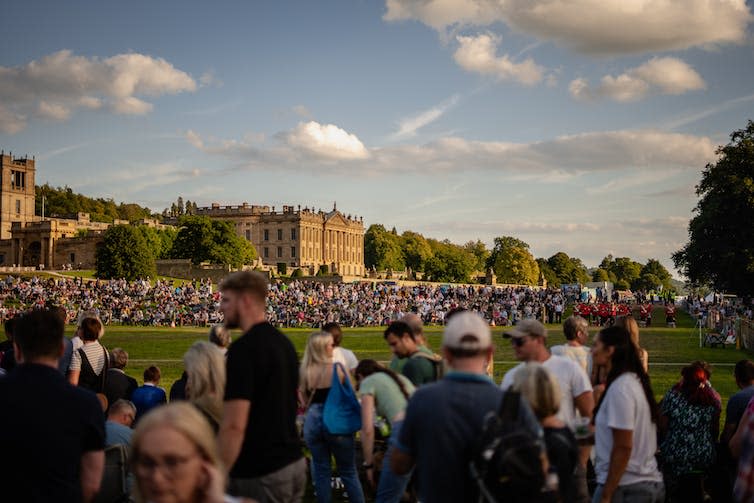 A crowd on a lawn.