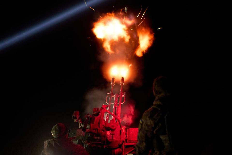 Soldiers of the Armed Forces of Ukraine from the unit of the mobile air defense group shoot down enemy drones using the ZU-23-2 Soviet 23-mm twin anti-aircraft gun on April 16, 2024 in an undisclosed location in Ukraine. (Kostiantyn Liberov/Libkos/Getty Images)