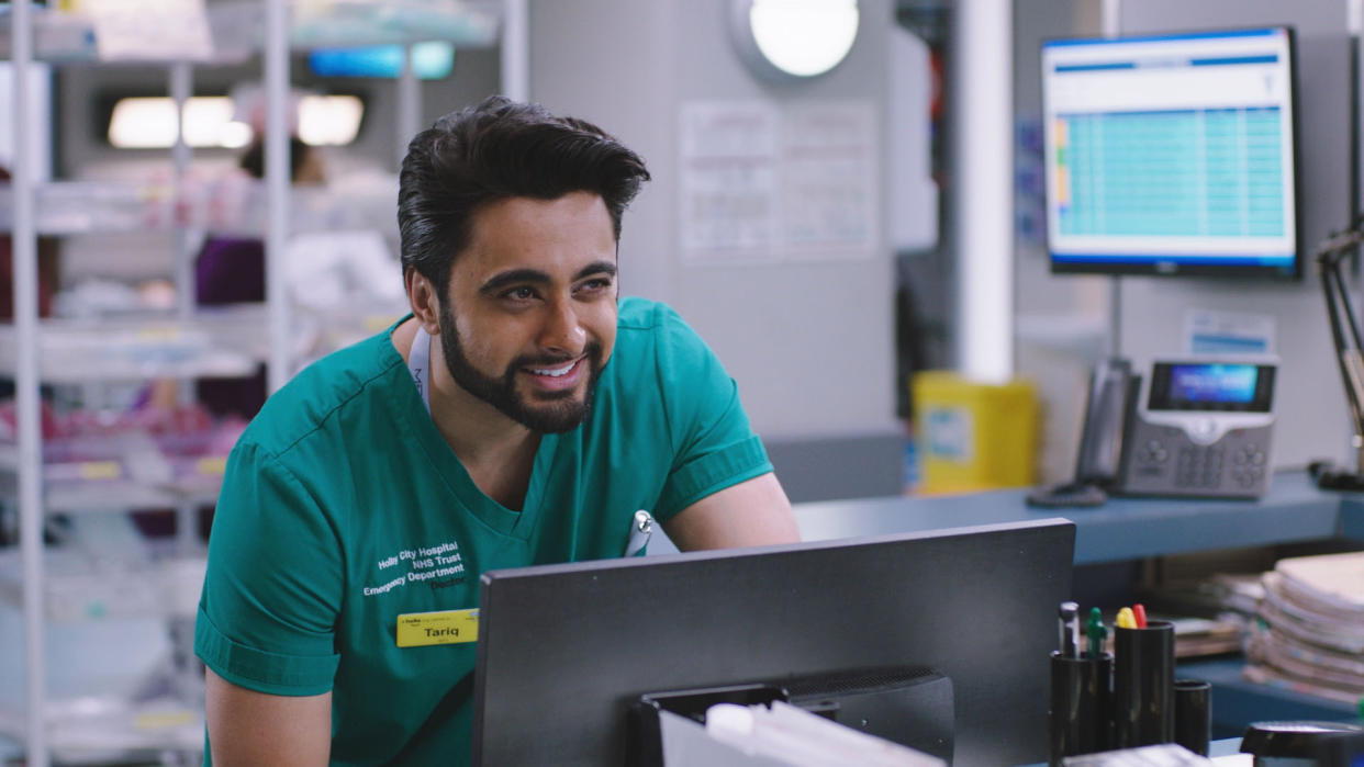  Casualty star Manpreet Bachu as a smiling junior doctor Tariq Hussein. . 