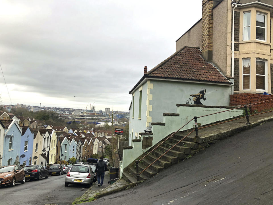 Banksy's latest mural titled “Aachoo!!” that has appeared on a wall in Bristol, England, Thursday Dec. 10, 2020. Banksy's latest mural has delayed - but not thwarted - a homeowner's plans to sell in Bristol after it recently appeared on the house's exterior wall. (Claire Hayhurst/PA via AP)