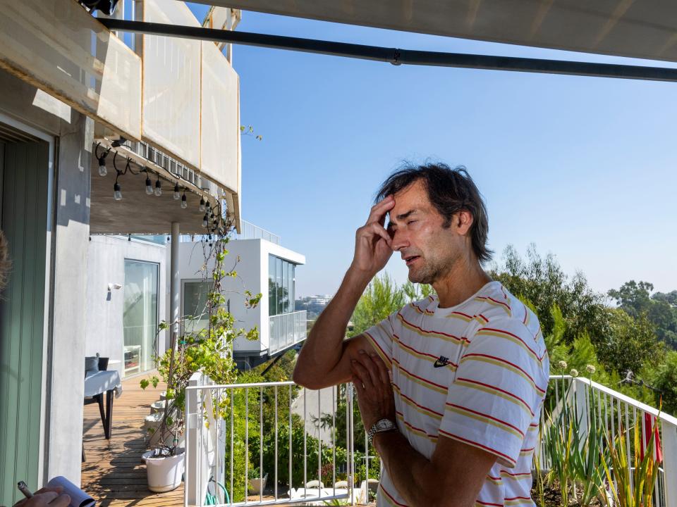 Sascha Jovanovic, a Airbnb landlord, stands on the deck of his Los Angeles home.