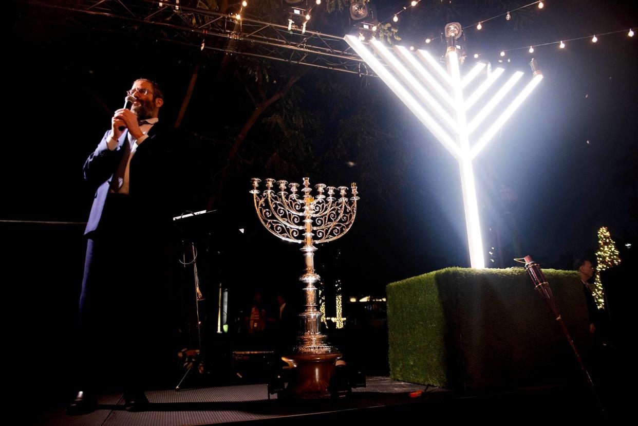 Rabbi Moshe Scheiner, of Palm Beach Synagogue, speaks before the lighting of the menorah at Bradley Park last year. The annual Hanukkah event returns Thursday, which marks the first night of the Jewish holiday.