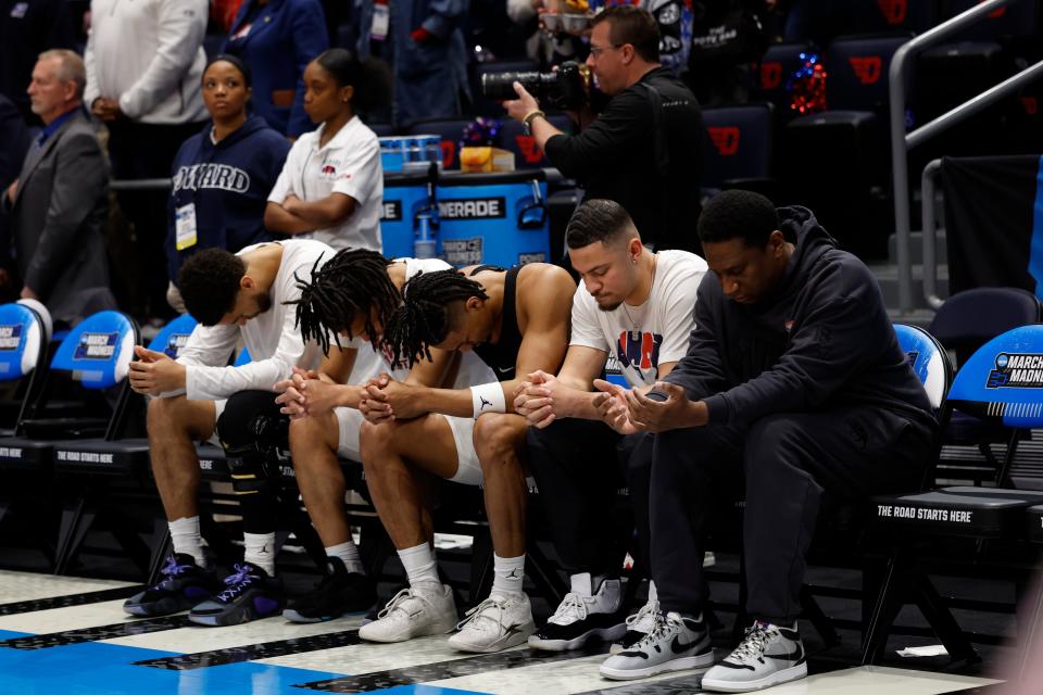 Howard Bison head coach Kenny Blakeney and players sit for the Nation Anthem before the game against the Wagner Seahawks at UD Arena.