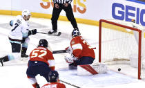 Seattle Kraken right wing Jordan Eberle (7) scores a goal past Florida Panthers goaltender Spencer Knight (30) during the first period of an NHL hockey game Saturday, Nov. 27, 2021, in Sunrise, Fla. (AP Photo/Jim Rassol)