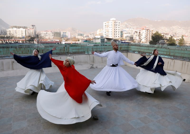 Mirzaie, founder of a Sama Dance group dances with her teammates in Kabul