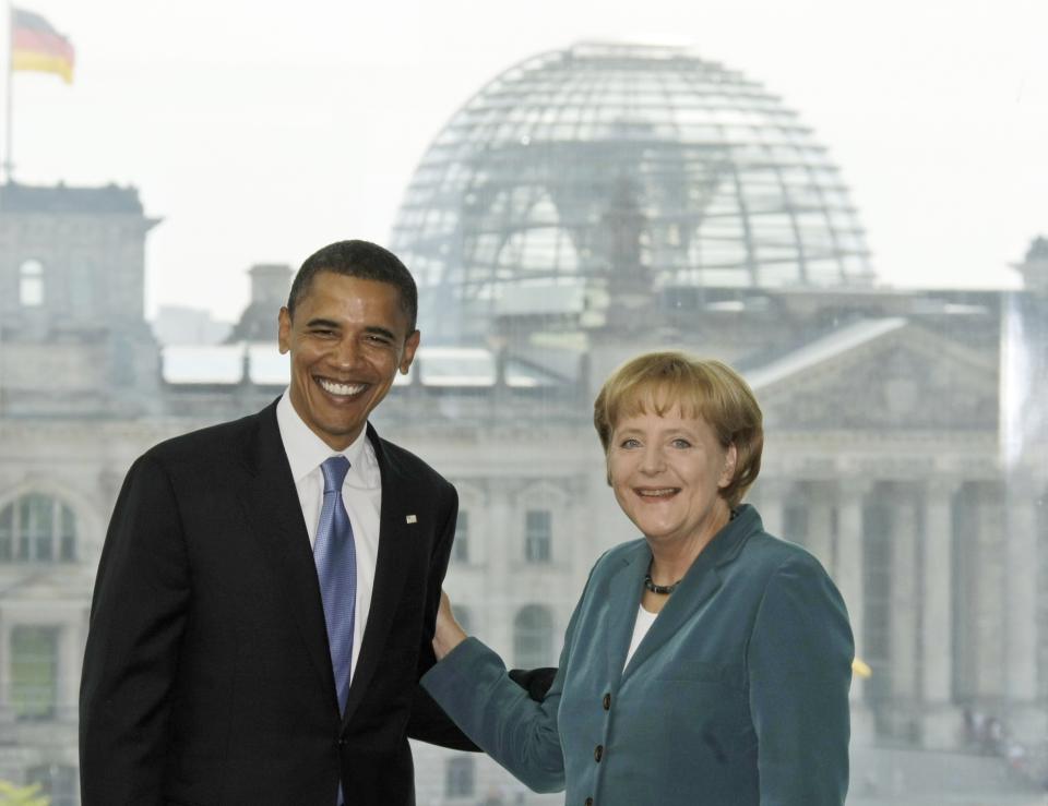 FILE - In this July 24, 2008 file photo, U.S. Democratic presidential candidate Sen. Barack Obama, D-Ill., left, is welcomed by German Chancellor Angela Merkel in the chancellery in Berlin, Germany. Angela Merkel has just about seen it all when it comes to U.S. presidents. Merkel on Thursday makes her first visit to the White House since Joe Biden took office. He is the fourth American president of her nearly 16-year tenure as German chancellor. (AP Photo/Herbert Knosowski, File)