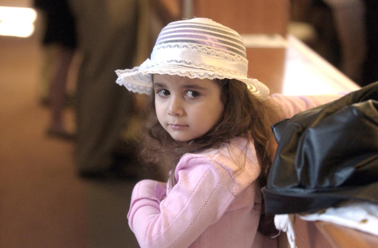 Josie Mazzola, 4, of Newark, looks back at her mother while Bishop Michael Saltarelli, of Wilmington, leads the Easter service at St. Margaret of Scotland RC Church in Newark Sunday, March 23, 2008. Saltarelli established the new parish to provide for the growing denomination.
Special to the News Journal/ Emily Varisco