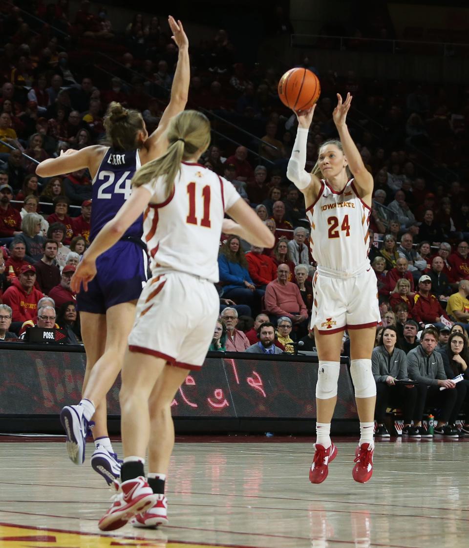 Iowa State Cyclones guard/forward Ashley Joens (24) takes a 3-point shot over Kansas State Wildcats guard Emilee Ebert (24) during Wednesday's game.