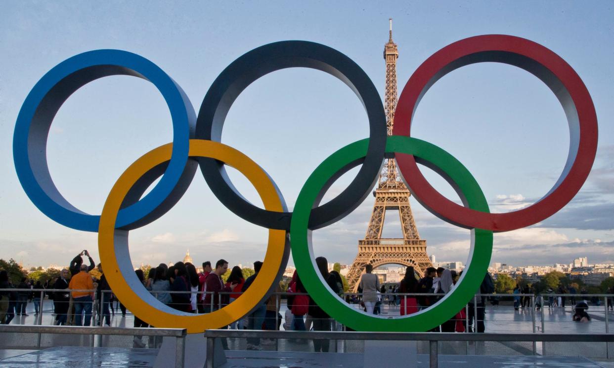 <span>The Olympic rings in the Place du Trocadéro overlooking the Eiffel Tower in Paris.</span><span>Photograph: Michel Euler/AP</span>