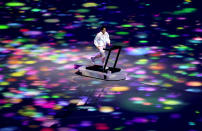 <p>TOKYO, JAPAN - JULY 23: A performer runs on a treadmill during the Opening Ceremony of the Tokyo 2020 Olympic Games at Olympic Stadium on July 23, 2021 in Tokyo, Japan. (Photo by Clive Brunskill/Getty Images)</p> 