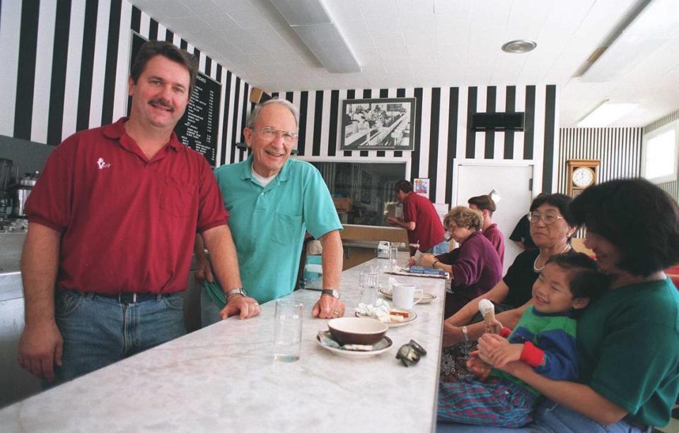 Craig Rutledge, left, and his father Ashley, center, stand at the counter at Vic’s Ice Cream in Land Park in 1995. The elder Rutledge opened the store with Vic Zito in 1947, and Craig followed his father into the business. Craig died on Monday at the age of 73.