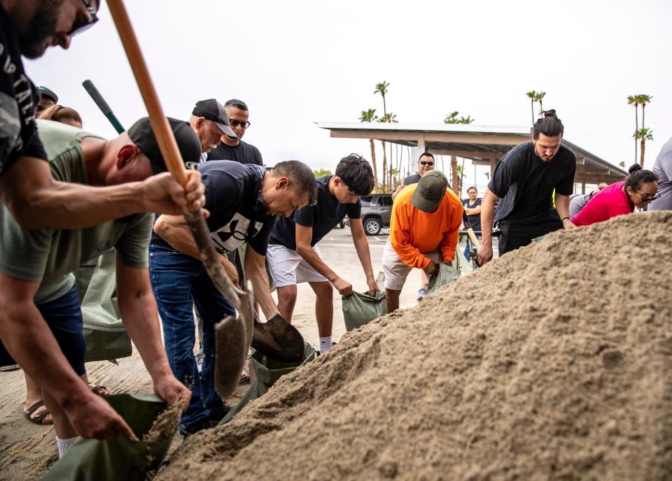 Residents fill sandbags at City Hall in Indio, Calif., Saturday, Aug. 19, 2023.