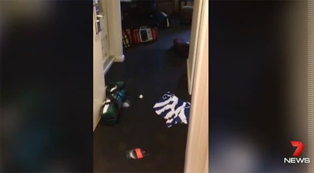 Police footage shows clothes strewn across the floor of the hotel room. Photo: 7 News