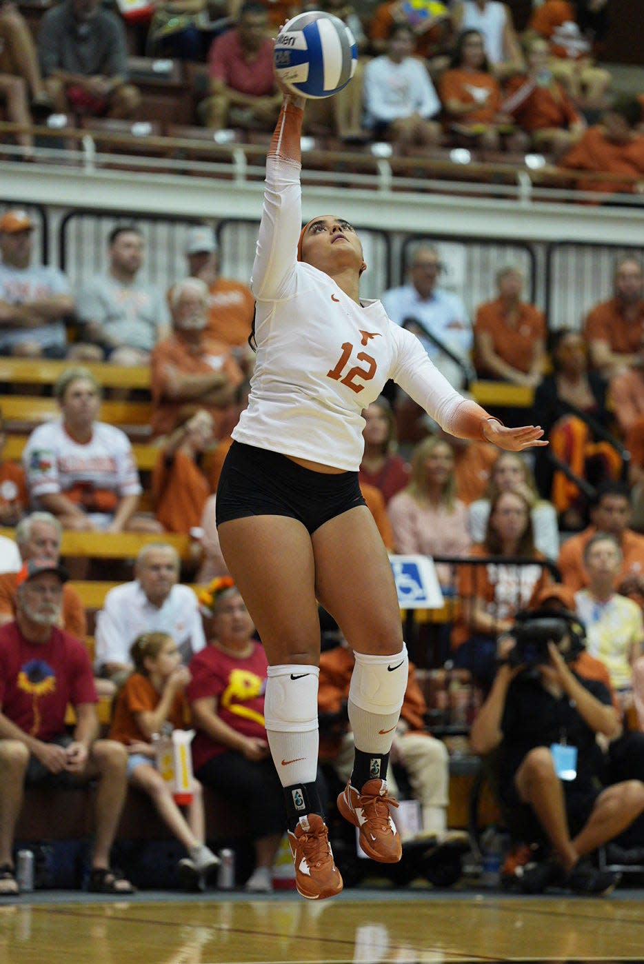 Texas' Keonilei Akana serves against TCU during the Longhorns' 3-0 sweep at Gregory Gym on Oct. 5. The Longhorns lost just once this season, at Iowa State in five sets late in October.