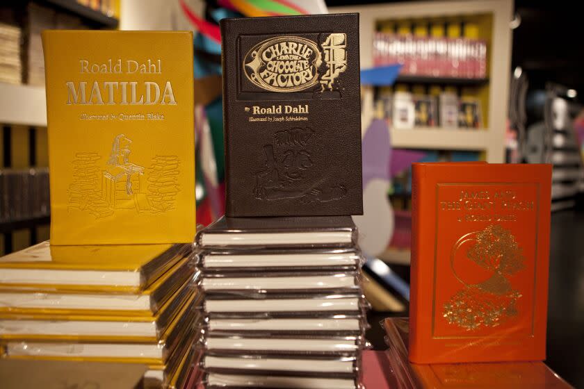 FILE - Books by Roald Dahl are displayed at the Barney's store on East 60th Street in New York on Monday, Nov. 21, 2011. Critics are accusing the publisher of Roald Dahl's classic children's books of censorship after it removed colorful language from stories such as "Charlie and the Chocolate Factory" and "Matilda" to make them more acceptable to modern readers. (AP Photo/Andrew Burton, File)