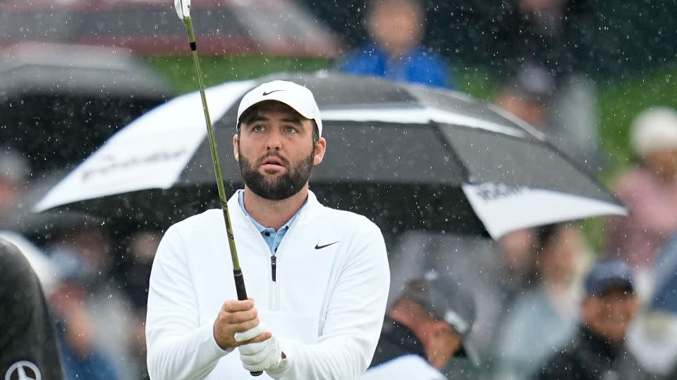 After his arrest, Scottie Scheffler warmed up before the second round of the PGA Championship on Friday. - Sue Ogrocki/AP