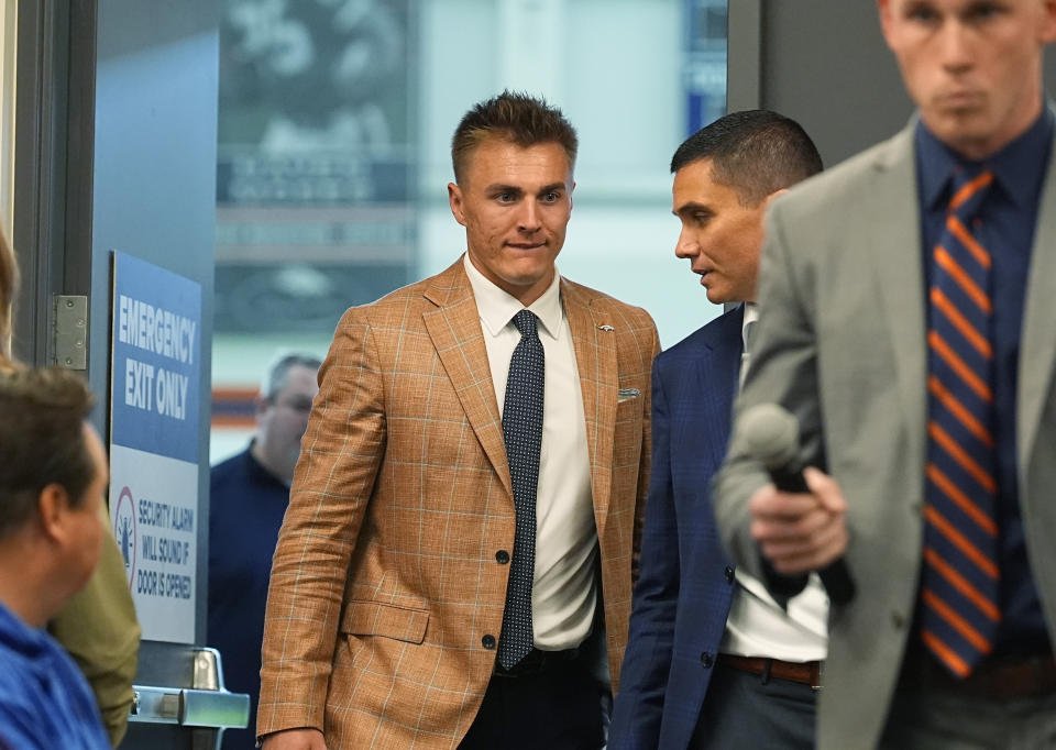 Quarterback Bo Nix arrives for an NFL football news conference Friday, April 26, 2024, with the Denver Broncos in Centennial, Colo. (AP Photo/David Zalubowski)