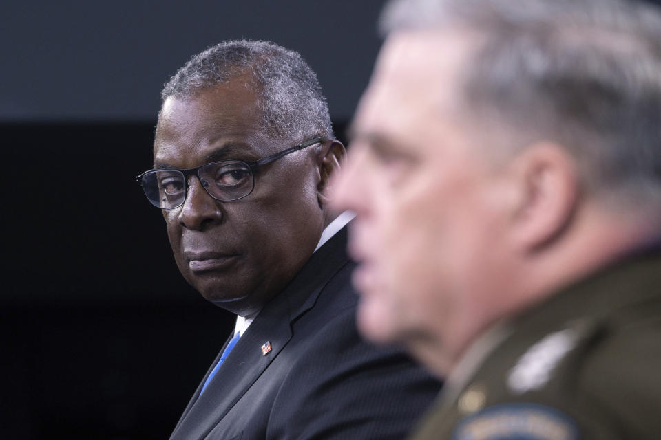 Defense Secretary Lloyd Austin, left, looks towards Joint Chiefs Chairman Gen. Mark Milley during a press briefing at the Pentagon, Wednesday, July 21, 2021 in Washington. (AP Photo/Kevin Wolf)