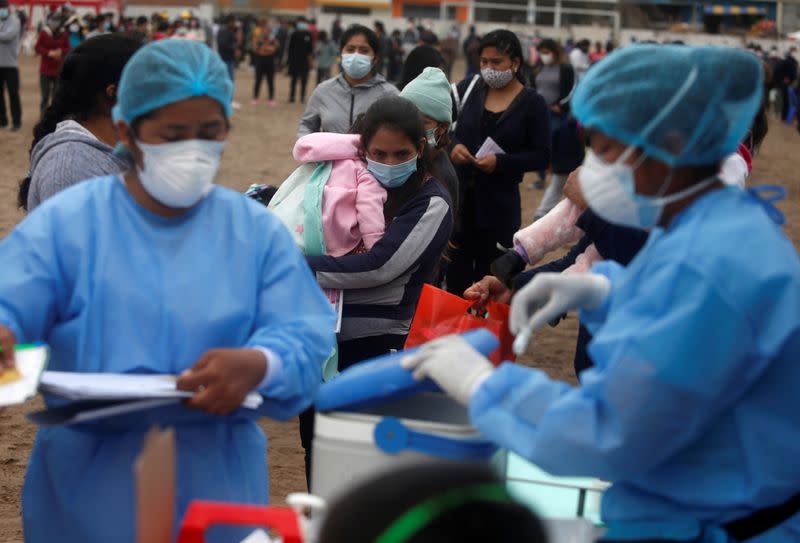 People wait in line to get vaccinated during a vaccination drive after several new cases of diphtheria were identified, as the coronavirus disease (COVID-19) outbreak continues, in Lima