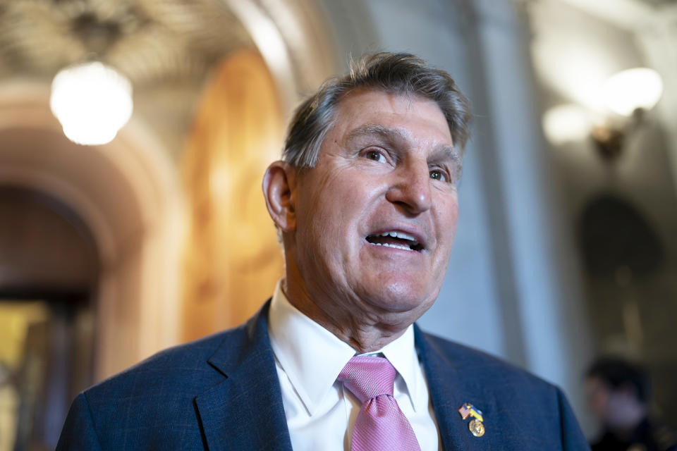 Sen. Joe Manchin, D-W.Va., chairman of the Senate Energy and Natural Resources Committee, speaks to a colleague just outside the chamber, at the Capitol in Washington, Tuesday, June 13, 2023. (J. Scott Applewhite / AP file)