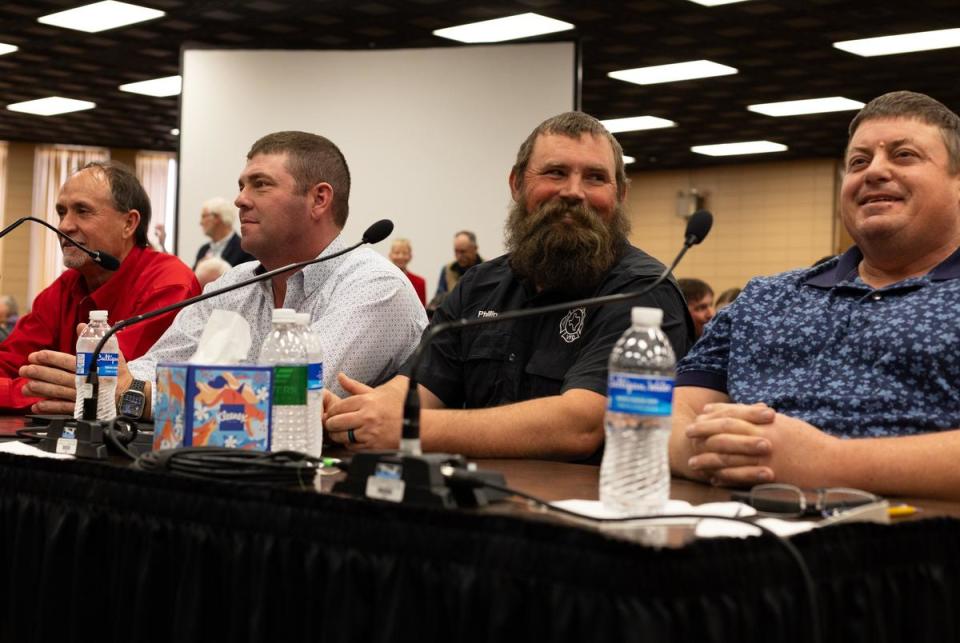 From left: Local firemen Robert Ford, Trent Price, Phillip Clark and Scott Brewster sit on a panel during an investigative house committee hearing on the Texas Panhandle wildfires on Tuesday, April 2, 2024 in Pampa.