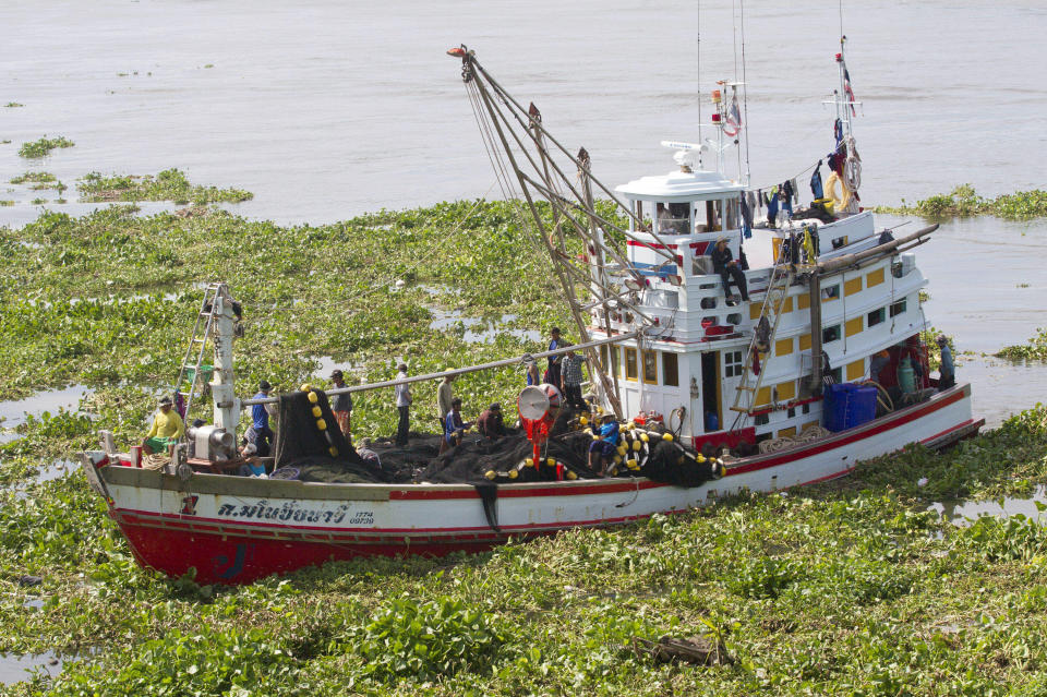 FILE - In this Sept. 3, 2013, file photo, a Thai trawler returns to port after a fishing trip in the waters of the Gulf of Thailand in Samut Sakhon Province, west of Bangkok, Thailand. The country reported more than 500 new coronavirus cases on Saturday, Dec. 19, 2020, the highest daily tally in a country that had largely brought the pandemic under control. (AP Photo/Sakchai Lalit, File)