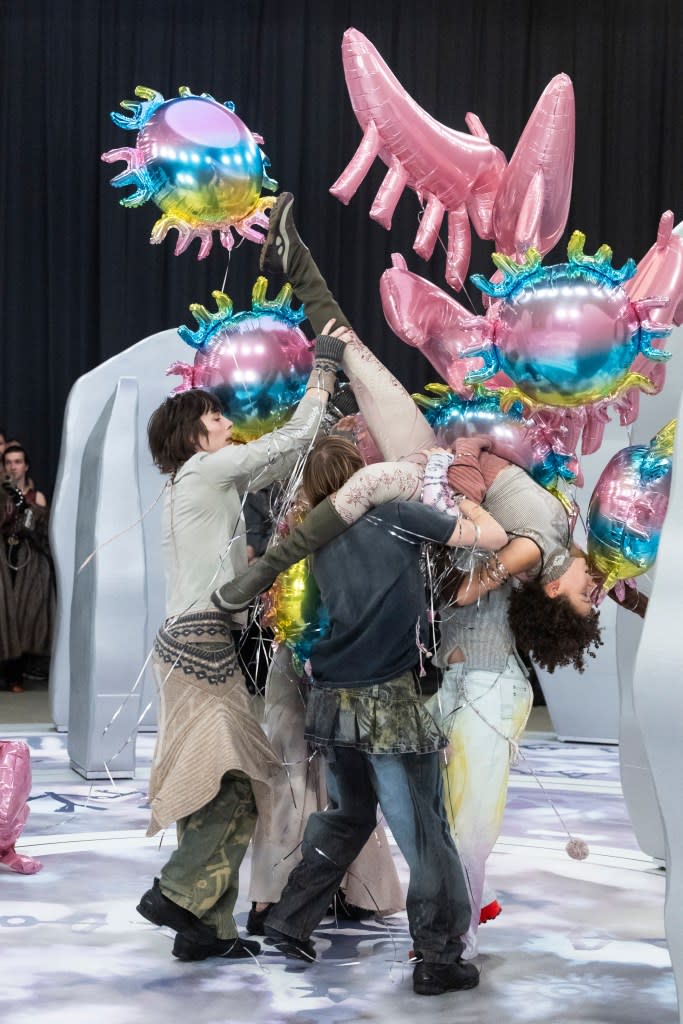 At one point in the show, a model was lifted off the ground as the balloons wrapped around them. Getty Images