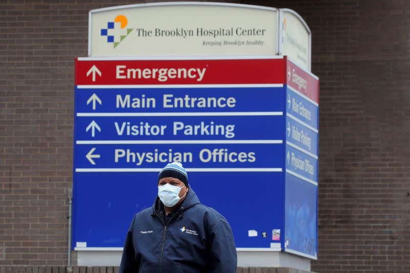 FILE PHOTO: A health worker exits the Brooklyn Hospital Center, during the coronavirus disease (COVID-19) outbreak in Brooklyn, New York