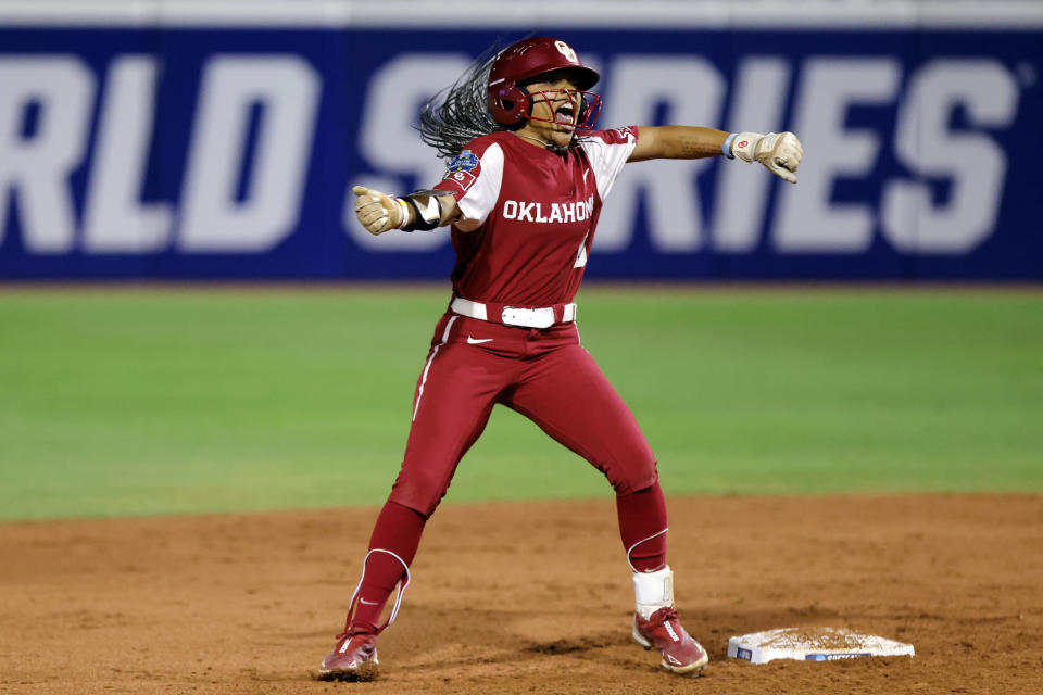 Oklahoma's Rylie Boone celebrates at second base after hitting a double against Florida State during the third inning of the first game of the NCAA Women's College World Series softball championship series Wednesday, June 7, 2023, in Oklahoma City. (AP Photo/Nate Billings)