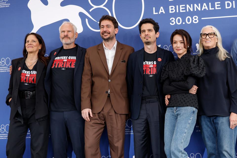 Jury members Laura Poitras (left), Martin McDonagh, Santiago Mitre, jury president Damien Chazelle, Shu Qi and Jane Campion pose during the 80th annual Venice International Film Festival on Aug. 30, 2023.