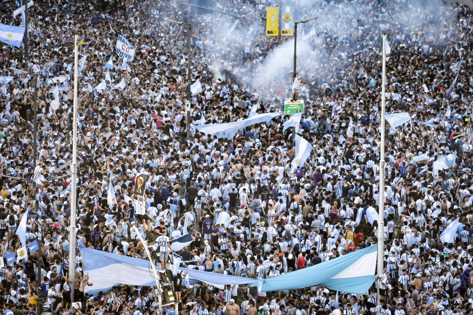 BUENOS AIRES, ARGENTINA - DECEMBER 18:  Fans of Argentina celebrate after winning the final match of the FIFA World Cup Qatar 2022 against France on December 18, 2022 in Buenos Aires, Argentina. (Photo by Marcelo Endelli/Getty Images)