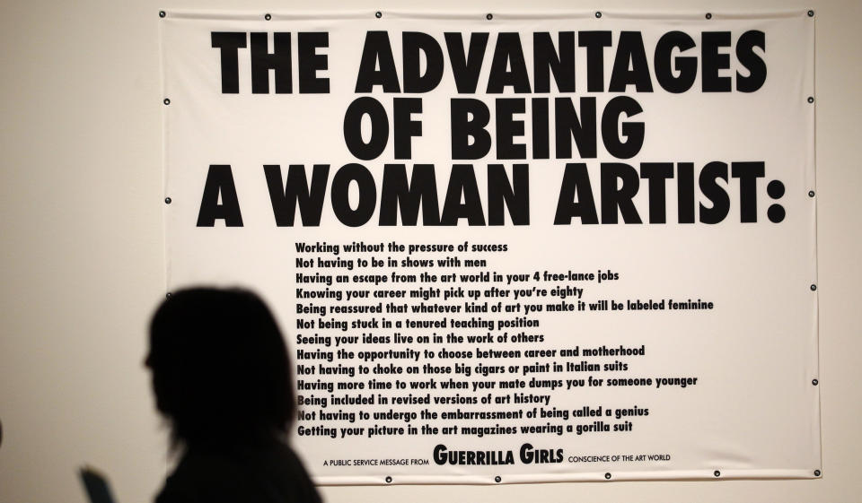 In this photo taken Tuesday, Oct. 9, 2012, a Guerrilla Girls poster is seen as part of one of two new exhibits featuring art exclusively by women at the Seattle Art Museum, in Seattle. Included in the exhibition is the only U.S. stop for an exhibit from the Pompidou Center in Paris, home of the modern art museum there, of painting, sculpture, drawing, photography and video. The exhibit runs through Jan. 13, 2013. (AP Photo/Elaine Thompson)