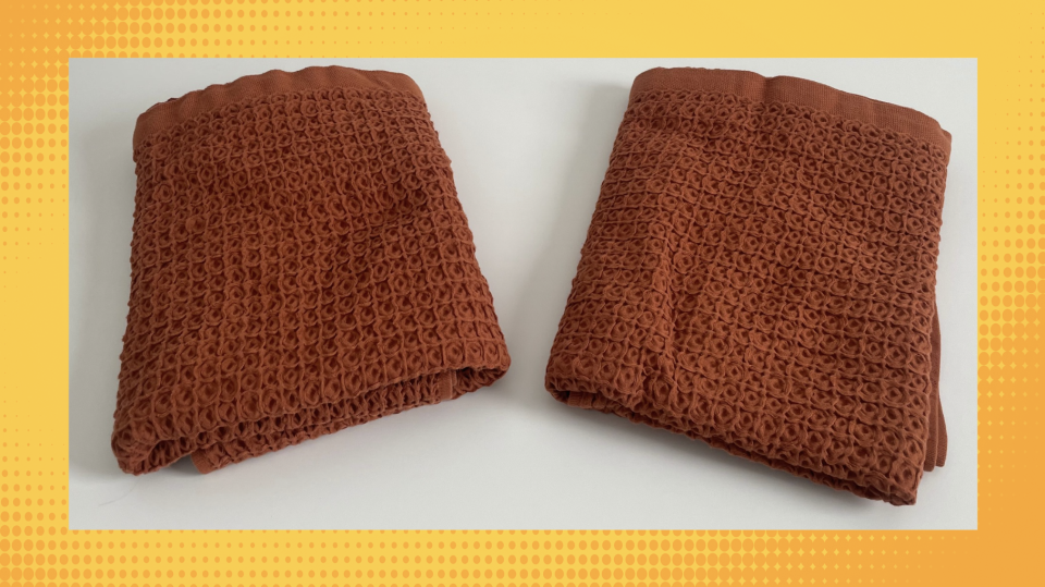 New, left, and washed West Elm Waffle Towels in a rust color