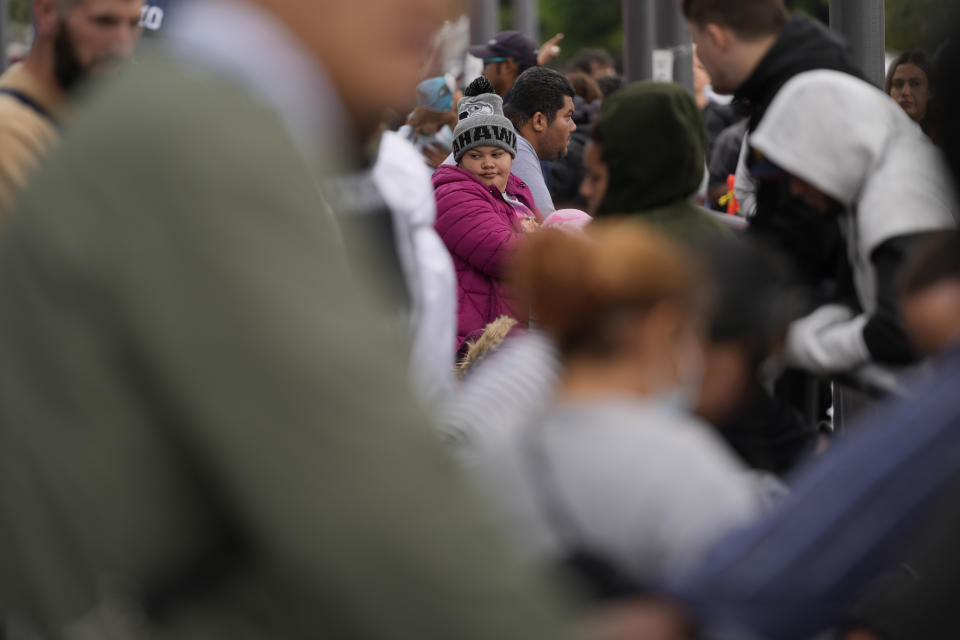 People waiting to apply for asylum camp near the pedestrian entrance to the San Isidro Port of Entry, linking Tijuana, Mexico with San Diego, Thursday, June 1, 2023, in Tijuana, Mexico. U.S. authorities raised the number of people allowed to enter the country with an online app allows asylum-seekers to enter the country with appointments to 1,250 a day from 1,000 though demand still far outstrips supply. (AP Photo/Gregory Bull)