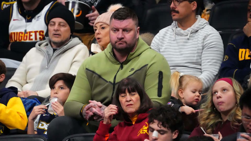 Strahinja Jokić (middle) watches a Denver Nuggets game against the Indiana Pacers on January 14, 2024. - Ron Chenoy/USA TODAY Sports/Reuters